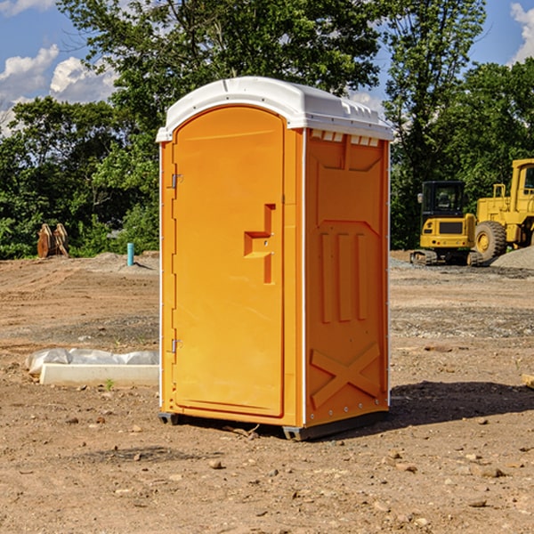 what is the cost difference between standard and deluxe portable toilet rentals in Gilmore City